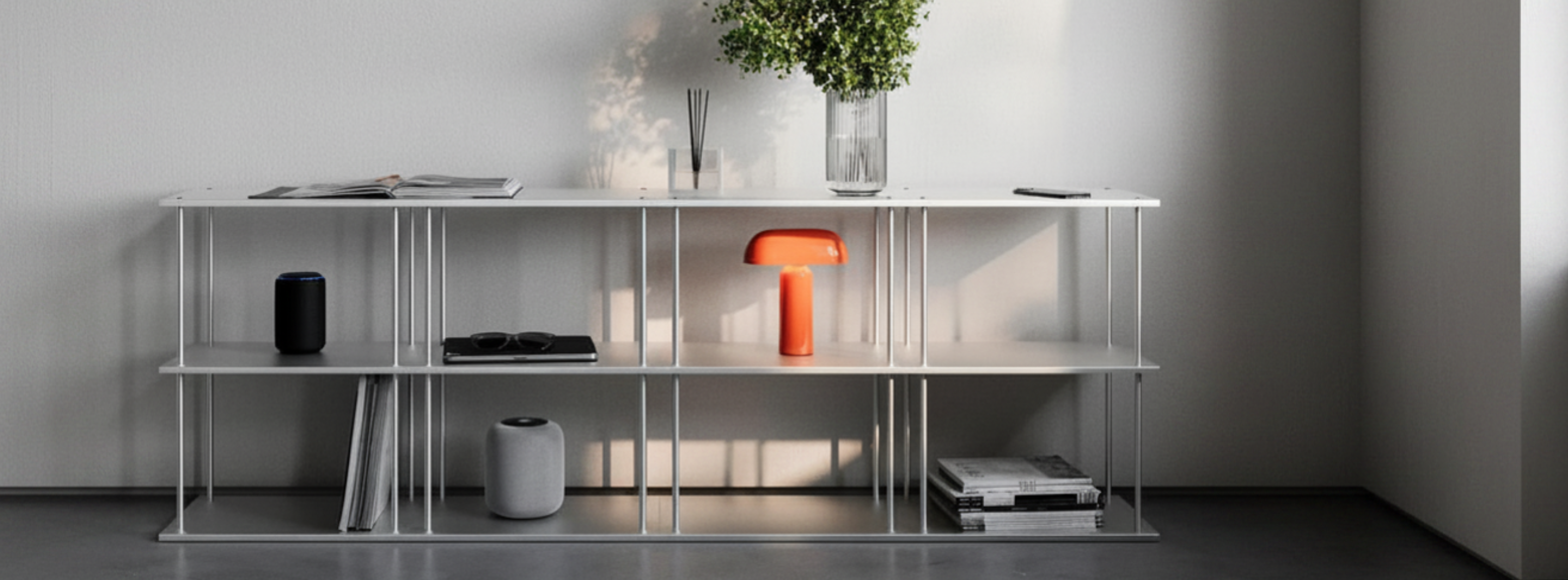 Precision-engineered modular aluminum shelving system with a natural brushed finish, showcasing vertical stacking and horizontal expansion.
