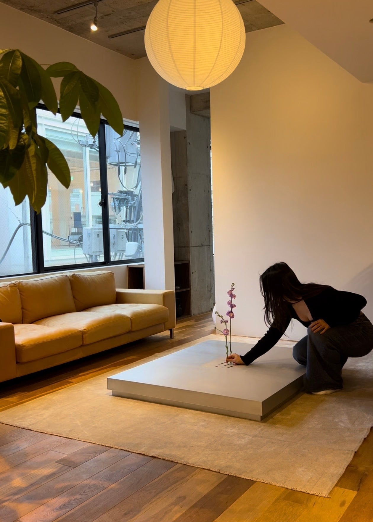 Low metal table. Hole with cover