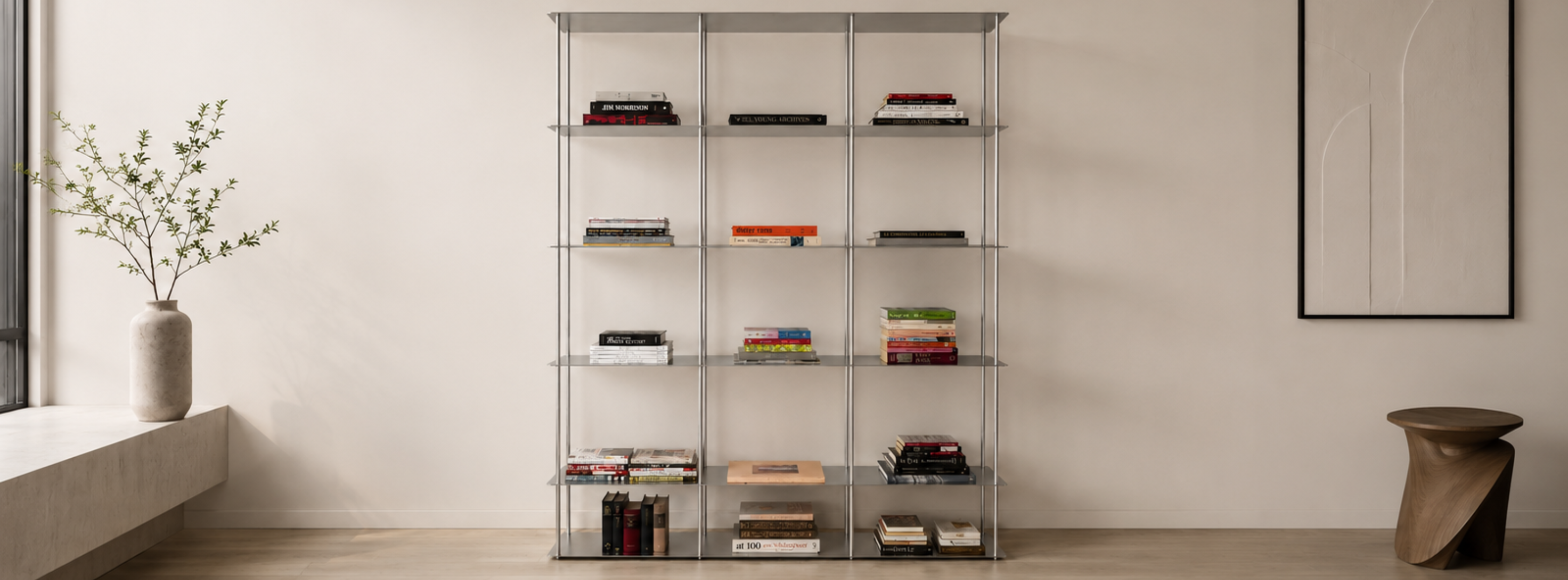 Multi-tier modular metal bookcase by AlumProject in a home office study, displaying books and office accessories.