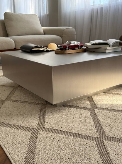 Square metal table with a leg
