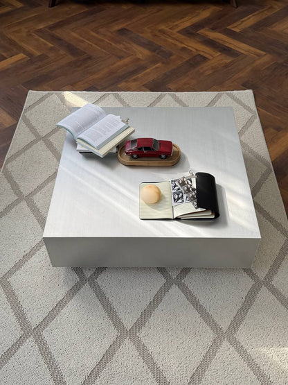 Square metal table with a leg